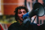 Un ragazzo lancia degli slogan con un megafono durante una manifestazione che ha mobilitato tutta lacitt contro la chiusura delle acciaierie di Terni.