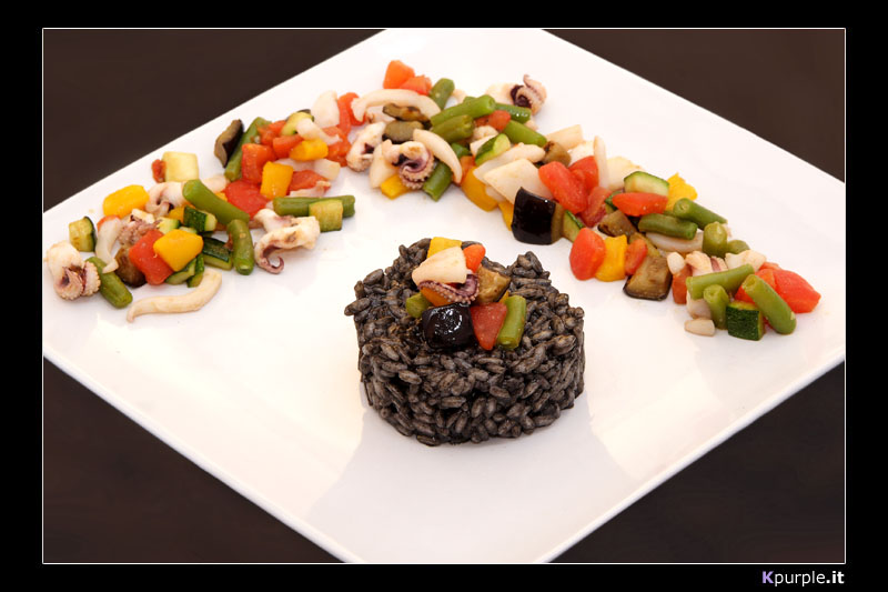 Risotto al nero di seppia con verdurine confit