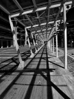 A lonely man in a cage of shadows and steel...