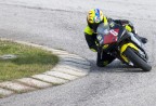 Un bambino in sella ad una strana moto in un kartodromo...
... ma che pieghe...

Massimiliano