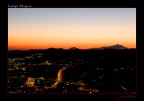 La conca di Agnano attraversata dalla tangenziale al tramonto. Sullo sfondo la sagoma di Ischia.