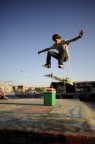 Kick flip over the fridge by Andrea