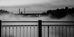 Nebbia sul fiume Adda tra il ponte di Trezzo sull'Adda e il ponte dell'autostrada tra Trezzo sull'Adda e Capriate. Sul sfondo a sinistra il castello del signor Crespi e le ciminiere del cotonificio Crespi a Crespi, sito Unesco.