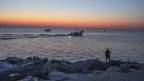 Vongolieri,e pescatore All'alba..