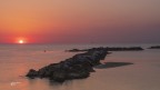 La scogliera ed il sorgere del sole.. Pesaro